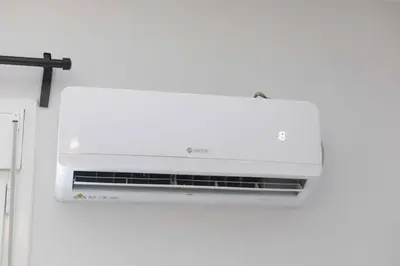 a white air conditioner hanging on a wall at The brand new House meets the ideal location Apt2 in Athens