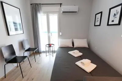 a room with a bed with two white towels on it at The brand new House meets the ideal location Apt2 in Athens
