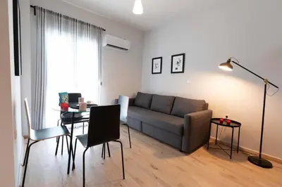 a living room with a couch and a table at The brand new House meets the ideal location Apt2 in Athens