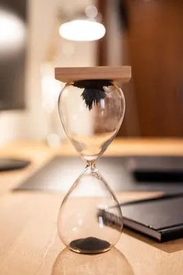 an hourglass sitting on top of a table at Two bedroom Apt in Syntagma - Ermou area in Athens
