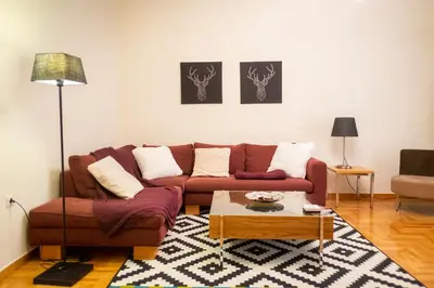 a living room with a couch and a coffee table at Two bedroom Apt in Syntagma - Ermou area in Athens