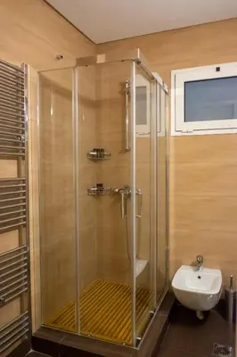 a bathroom with a shower with a sink and a toilet at Two bedroom Apt in Syntagma - Ermou area in Athens