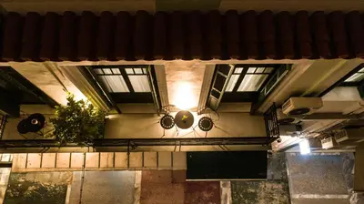 a view of a building with windows and plants at Pandrosos Divine Suites in Athens