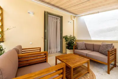 a living room with a couch and a table at Asty Luxury Apartments in Athens