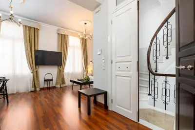 a living room with a sliding door and a tv at Asty Luxury Apartments in Athens