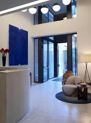 a lobby with a couch and a table at xenodocheio Milos in Athens