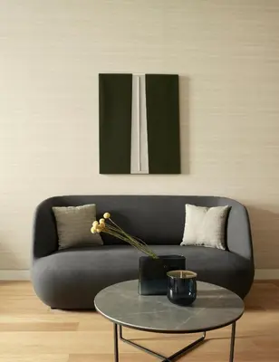 a living room with a black couch and a table at xenodocheio Milos in Athens