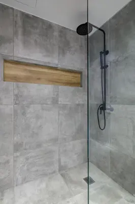 a shower with a glass door in a bathroom at Acropolis Magenta Luxury Suites in Athens