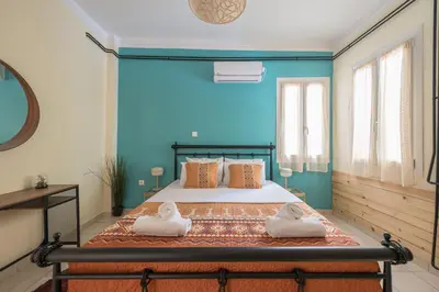 a bedroom with a bed with two towels on it at Athens Country House - Heated Jacuzzi - free bikes in Athens