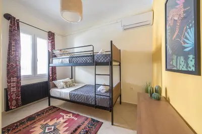 a bedroom with two bunk beds in a room at Athens Country House - Heated Jacuzzi - free bikes in Athens