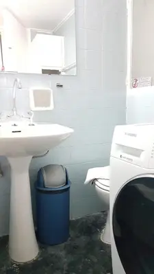 a bathroom with a sink and a toilet at Orange Apartment - Athens Center, 3 BD, 1.5 BATH in Athens