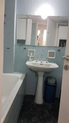 a bathroom with a sink and a bath tub at Orange Apartment - Athens Center, 3 BD, 1.5 BATH in Athens