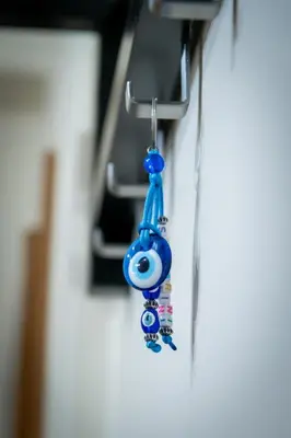 a pair of blue earrings hanging from a wall at 2bed renovated flat close to Ampelokipoi metro in Athens