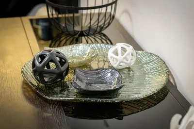 a glass plate with some items on a table at 2bed renovated flat close to Ampelokipoi metro in Athens