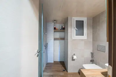 a bathroom with a white toilet and a sink at 2bed renovated flat close to Ampelokipoi metro in Athens