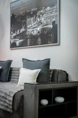 a living room with a bed and a picture on the wall at 2bed renovated flat close to Ampelokipoi metro in Athens