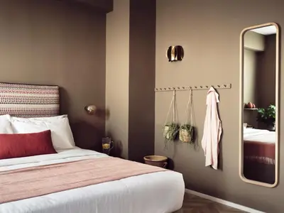 a bedroom with a bed and a large mirror at Pallineon House in Athens