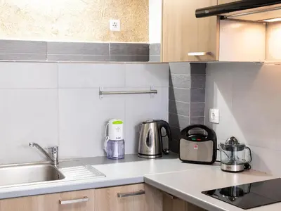 a kitchen with a sink and a counter top at Monastiraki Sweet House 1 in Athens