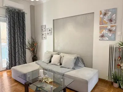 a living room with a bed and a glass table at 2 Bedrooms Apartment Center of Athens 4 min Subway in Athens