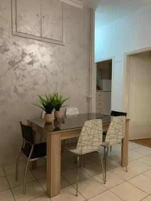 a dining room with a wooden table and chairs at 2 Bedrooms Apartment Center of Athens 4 min Subway in Athens