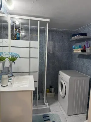 a bathroom with a washing machine and a sink at 2 Bedrooms Apartment Center of Athens 4 min Subway in Athens