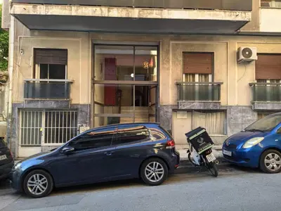 a blue car parked in front of a building at 2 Bedrooms Apartment Center of Athens 4 min Subway in Athens