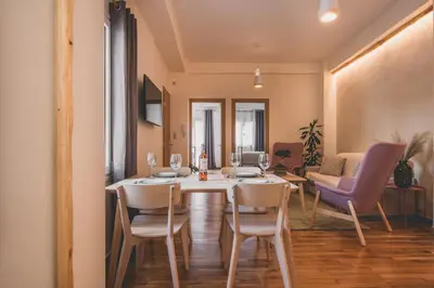 a dining room with a table and chairs at Luxury Apartment with Acropolis View Terrace and Jacuzzi - Living Stone Moonstone in Athens