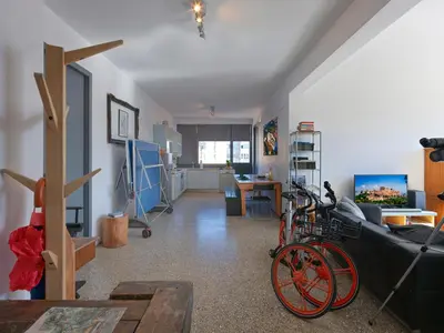 a living room with a bike parked in a room at Eastern Aromas loft in Psyri, Athens in Athens