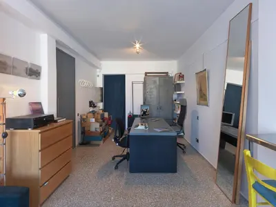 an office with a desk with chairs and a mirror at Eastern Aromas loft in Psyri, Athens in Athens