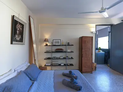 a bedroom with a bed with two teddy bears on it at Eastern Aromas loft in Psyri, Athens in Athens