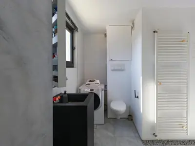 a small bathroom with a toilet and a sink at Eastern Aromas loft in Psyri, Athens in Athens