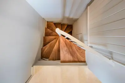 a staircase in a house with wooden floors at Sunny Loft with Acropolis View in Athens