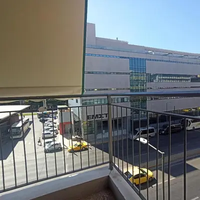 a balcony with a view of a parking lot at Chrishome in Athens