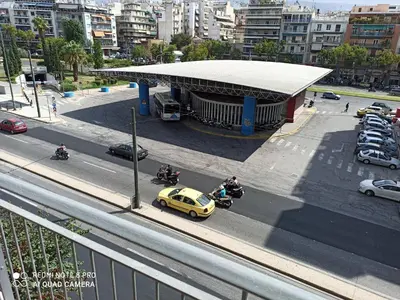 a yellow car parked in front of a gas station at Chrishome in Athens