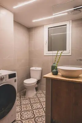 a bathroom with a toilet and a sink at Luxury Apartment with Acropolis view Terrace and Jacuzzi in the Heart of Athens - Living Stone Azurite in Athens