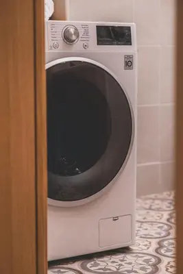a white microwave oven sitting in a bathroom at Luxury Apartment with Acropolis view Terrace and Jacuzzi in the Heart of Athens - Living Stone Azurite in Athens