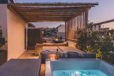 a hot tub on the balcony of a house at Luxury Apartment with Acropolis view Terrace and Jacuzzi in the Heart of Athens - Living Stone Azurite in Athens