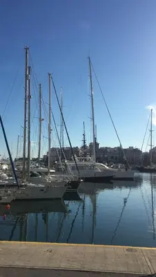 a group of sailboats are docked in a harbor at Kouklospito Cozy City Apartment in Kallithea Athens in Athens