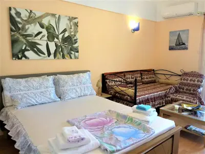 a room with a bed with towels on it at Athens Neoclassical in Athens