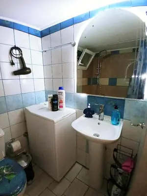 a small bathroom with a sink and a mirror at Athens Neoclassical in Athens