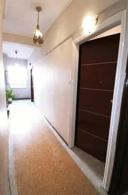 a hallway with a black garage door in a house at Athens Neoclassical in Athens
