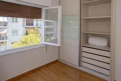 a room with a window and a closet at Upscale Luxury Athens Renovated Dream Home in One of the most Favorable Locations by National Gardens, Zoo & Hellenic Parliament in Syntagma and Stylish Exquisite Kolonaki neighborhood in Athens