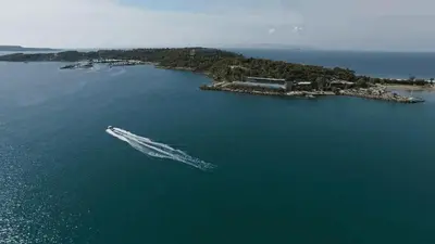 a boat in a large body of water at Amazing Garden House in Athens