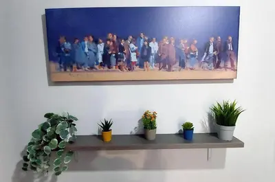 a painting of a group of people on a wall at METROPOLITAN MACVIEW-4 ΔΙΑΜΕΡΙΣΜΑ in Piraeus