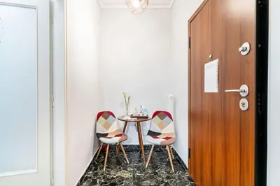 a dining room with a table and two chairs at Downtown Cute Apt in the Heart of Plaka (+Netflix) in Athens