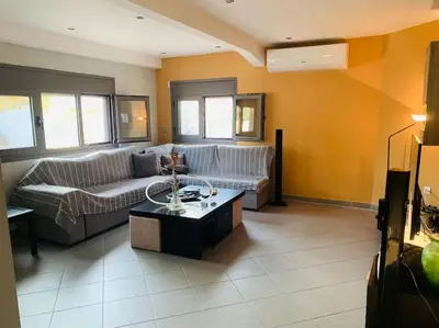 a living room with a couch and a coffee table at Astra House in Porto Rafti