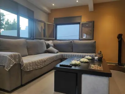 a living room with a couch and a coffee table at Astra House in Porto Rafti