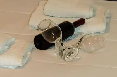 a pair of wine glasses and towels on a table at Cozy and comfortable apartment in Athens Center in Athens