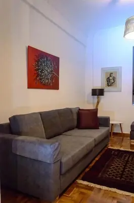 a living room with a gray couch in a room at Cozy and comfortable apartment in Athens Center in Athens