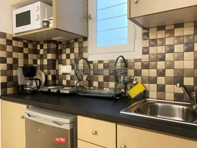 a kitchen with a sink and a counter top at GK Aria by GK Properties in Athens